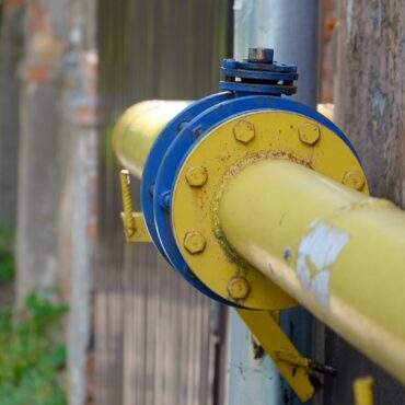 yellow gas pipe in front of residential building w LCD5TMC min 370x370 1